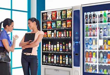Glass-front vending equipment stocked for workplace product choice